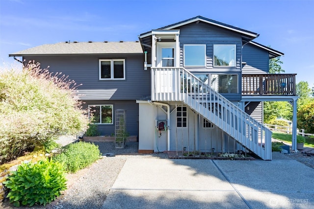 7332 156th St SE, Snohomish, WA 98296 - view of front facade with a deck and stairs