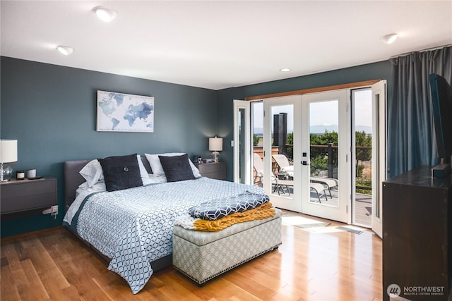 14785 Channel Dr, La Conner, WA 98257 - bedroom with french doors, access to outside, wood finished floors, and recessed lighting