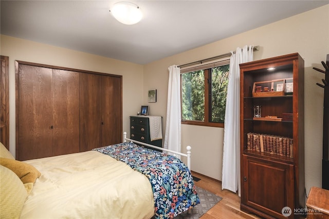 14785 Channel Dr, La Conner, WA 98257 - bedroom featuring light wood-style flooring and a closet