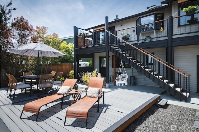 14785 Channel Dr, La Conner, WA 98257 - wooden deck featuring stairs and outdoor dining space