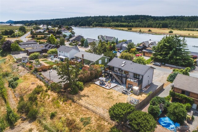 14785 Channel Dr, La Conner, WA 98257 - aerial view of residential area featuring a nearby body of water and a heavily wooded area