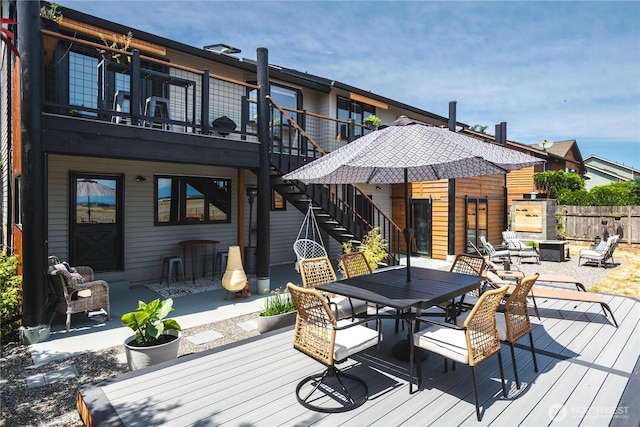 14785 Channel Dr, La Conner, WA 98257 - deck with outdoor dining space, stairway, and a patio