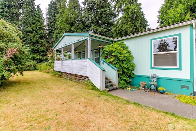 1106 29th St SE, Auburn, WA 98002 - view of side of property with crawl space, a yard, and covered porch