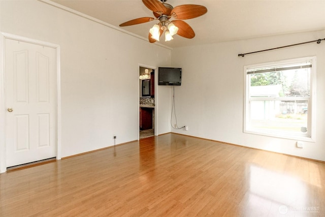 1106 29th St SE, Auburn, WA 98002 - spare room with wood finished floors and a ceiling fan