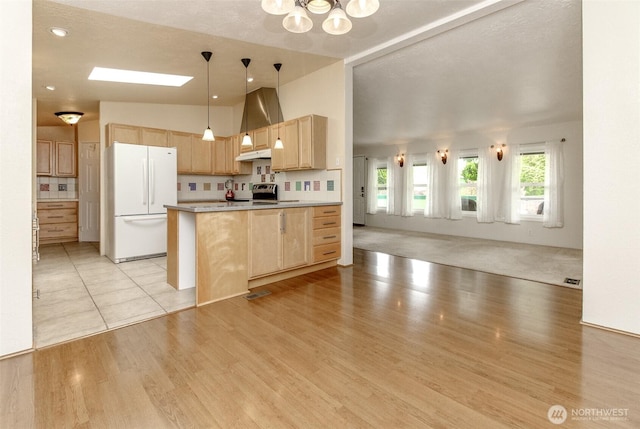 1106 29th St SE, Auburn, WA 98002 - kitchen with freestanding refrigerator, light brown cabinets, a chandelier, open floor plan, and light wood finished floors
