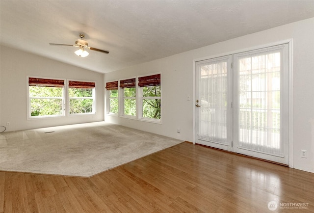 1106 29th St SE, Auburn, WA 98002 - unfurnished room featuring lofted ceiling, wood finished floors, a ceiling fan, and plenty of natural light