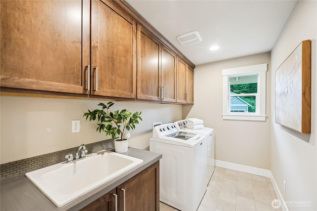 24130 145th Ave SE, Snohomish, WA 98296 - laundry room featuring separate washer and dryer, cabinet space, light tile patterned floors, and recessed lighting
