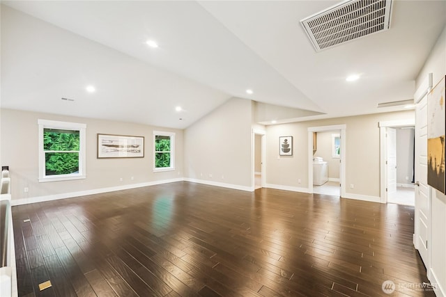 24130 145th Ave SE, Snohomish, WA 98296 - unfurnished living room with dark wood-style flooring, vaulted ceiling, recessed lighting, and washer / clothes dryer