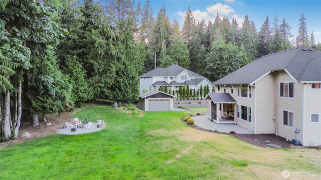 24130 145th Ave SE, Snohomish, WA 98296 - view of yard with an outdoor structure, a detached garage, and a patio area