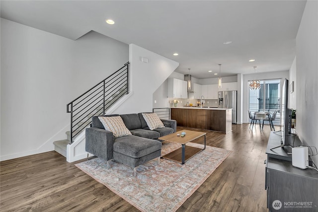 8537 22nd Pl NE, Seattle, WA 98115 - living area with dark wood-type flooring, stairway, recessed lighting, and a chandelier