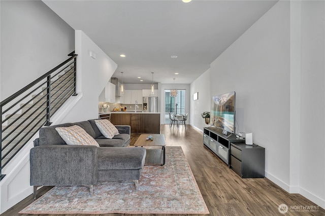8537 22nd Pl NE, Seattle, WA 98115 - living room with stairs, dark wood-style floors, recessed lighting, and a chandelier