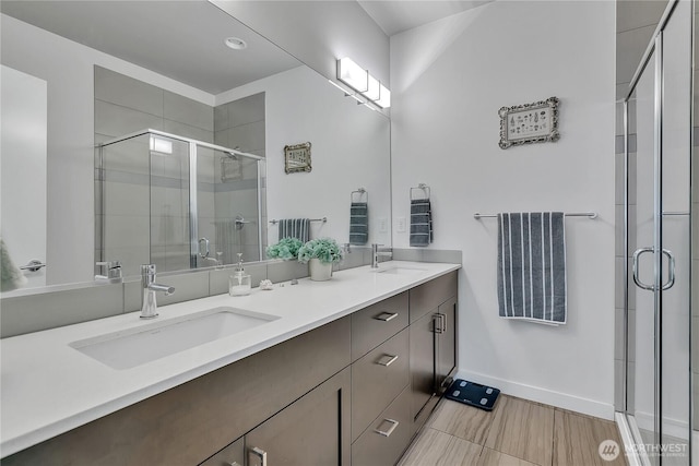 8537 22nd Pl NE, Seattle, WA 98115 - full bathroom featuring double vanity, a shower stall, and recessed lighting