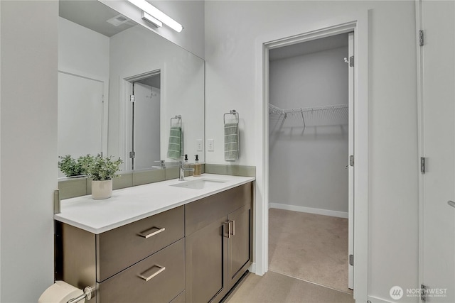 8537 22nd Pl NE, Seattle, WA 98115 - bathroom with vanity and a spacious closet