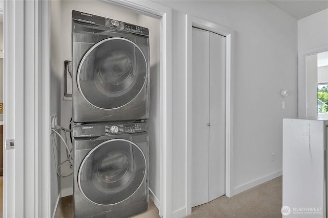 8537 22nd Pl NE, Seattle, WA 98115 - laundry room featuring stacked washer / dryer and carpet flooring