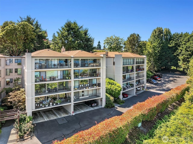 8005 Sand Point Way NE Unit A52, Seattle, WA 98115 - view of apartment building / complex featuring parking