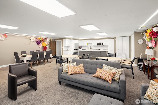 8005 Sand Point Way NE Unit A52, Seattle, WA 98115 - carpeted living area featuring a sink and baseboards