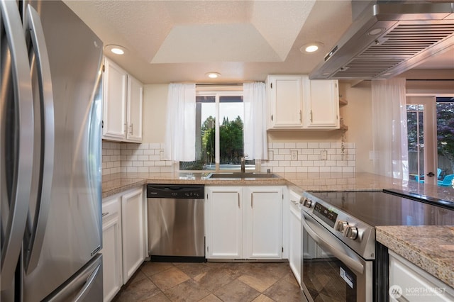 1717 SW 347th Pl, Federal Way, WA 98023 - kitchen with appliances with stainless steel finishes, extractor fan, white cabinets, recessed lighting, and tasteful backsplash