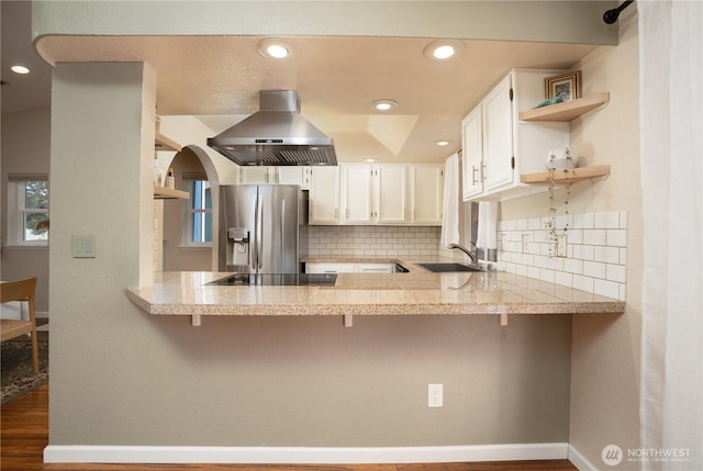 1717 SW 347th Pl, Federal Way, WA 98023 - kitchen with exhaust hood, stainless steel fridge, open shelves, black electric stovetop, and backsplash