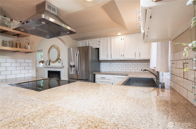 1717 SW 347th Pl, Federal Way, WA 98023 - kitchen with stainless steel fridge with ice dispenser, island exhaust hood, white cabinetry, and decorative backsplash