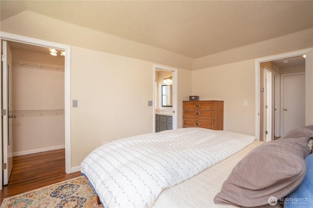 1717 SW 347th Pl, Federal Way, WA 98023 - bedroom featuring a closet, wood finished floors, and a walk in closet