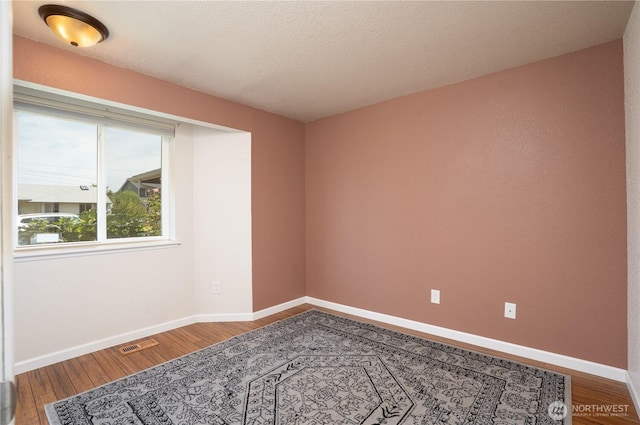1717 SW 347th Pl, Federal Way, WA 98023 - spare room with wood finished floors and baseboards