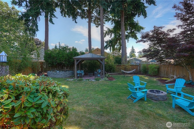 1717 SW 347th Pl, Federal Way, WA 98023 - fenced backyard with an outdoor fire pit, a gazebo, and a patio area