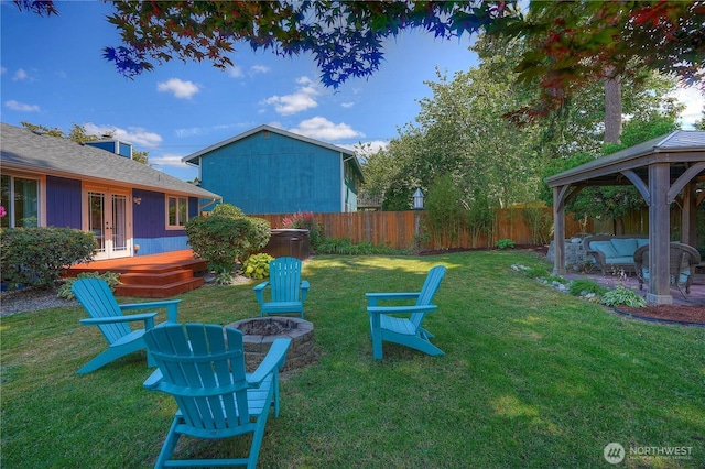 1717 SW 347th Pl, Federal Way, WA 98023 - fenced yard with a gazebo, an outdoor living space with a fire pit, french doors, and a wooden deck