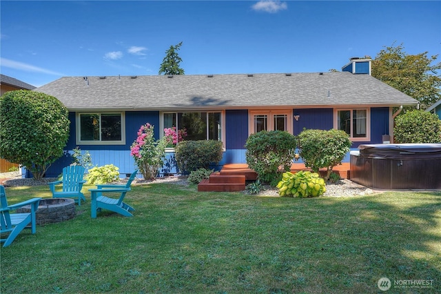 1717 SW 347th Pl, Federal Way, WA 98023 - view of front of house with a hot tub, an outdoor fire pit, roof with shingles, and a front lawn