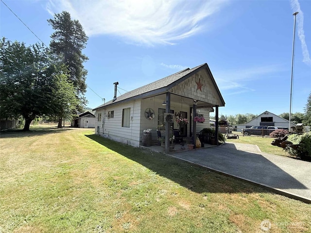 15 S Heise Rd, Elma, WA 98541 - view of side of property featuring a patio area