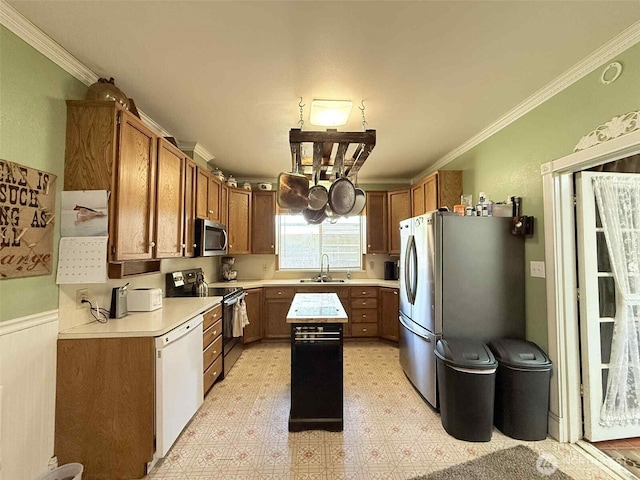 15 S Heise Rd, Elma, WA 98541 - kitchen featuring stainless steel appliances, light flooring, light countertops, crown molding, and a kitchen island