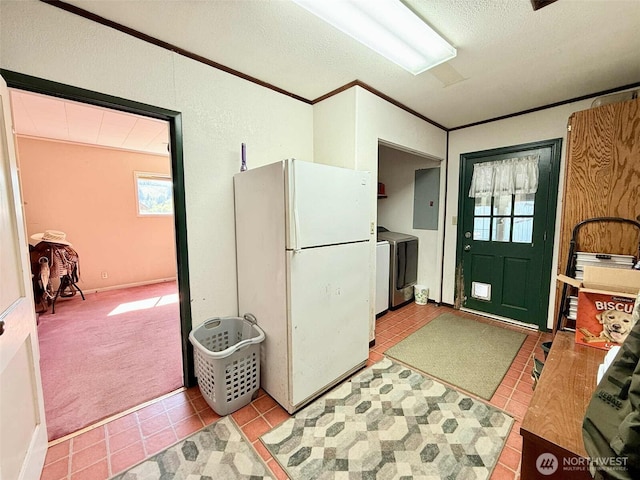15 S Heise Rd, Elma, WA 98541 - kitchen with freestanding refrigerator, washer and dryer, electric panel, tile patterned flooring, and crown molding