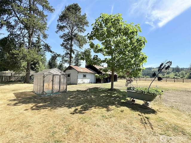 15 S Heise Rd, Elma, WA 98541 - view of yard featuring a greenhouse and an outbuilding