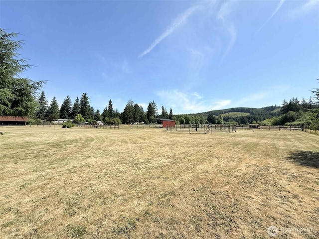 15 S Heise Rd, Elma, WA 98541 - view of yard with an enclosed horse arena, a rural view, an outbuilding, and an exterior structure