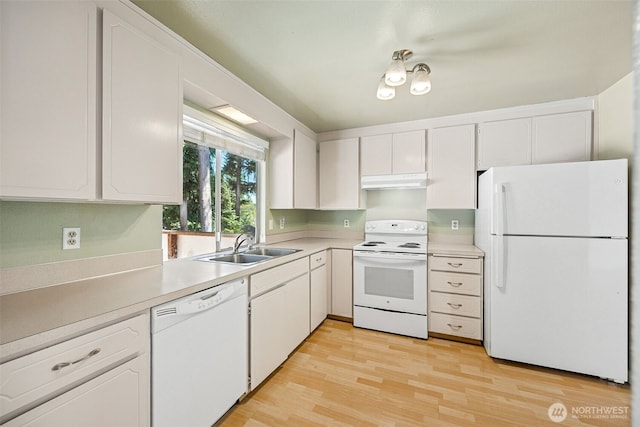 2810 Brentwood Dr SE, Lacey, WA 98503 - kitchen with white appliances, under cabinet range hood, light countertops, and white cabinetry