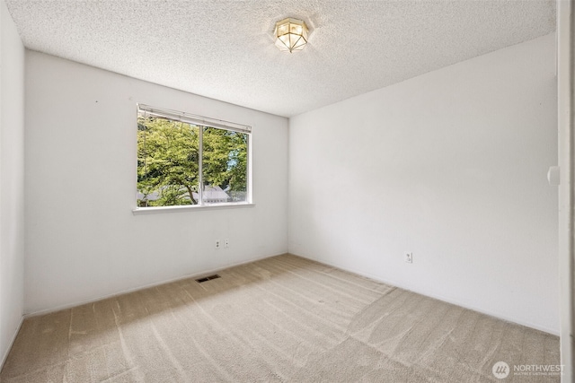 2810 Brentwood Dr SE, Lacey, WA 98503 - carpeted spare room featuring a textured ceiling