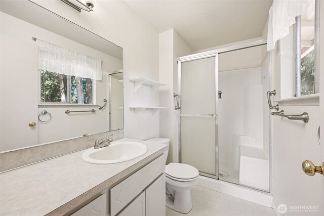 2810 Brentwood Dr SE, Lacey, WA 98503 - bathroom with a stall shower, vanity, and plenty of natural light