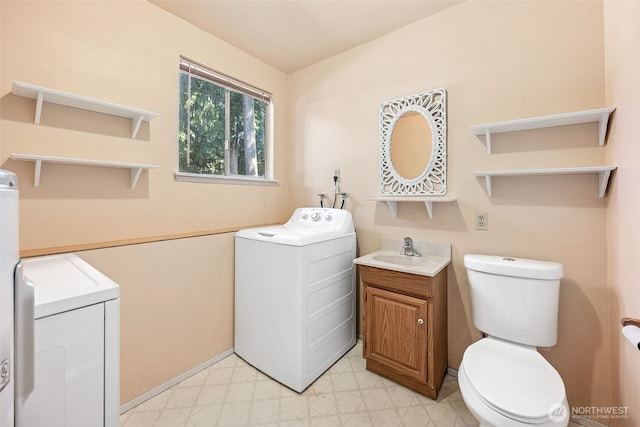 2810 Brentwood Dr SE, Lacey, WA 98503 - half bathroom featuring washer / dryer, tile patterned floors, and vanity
