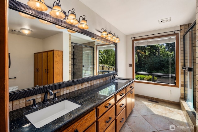 2515 87th Avenue Ct E, Edgewood, WA 98371 - bathroom with double vanity, a stall shower, and backsplash