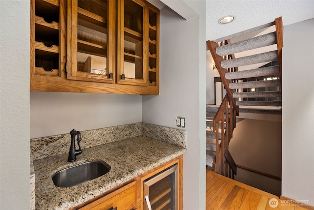 2515 87th Avenue Ct E, Edgewood, WA 98371 - bar area featuring wine cooler, light wood-style floors, and stairway