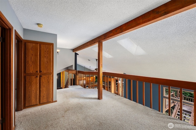 2515 87th Avenue Ct E, Edgewood, WA 98371 - corridor featuring carpet floors, an upstairs landing, a skylight, and a textured ceiling