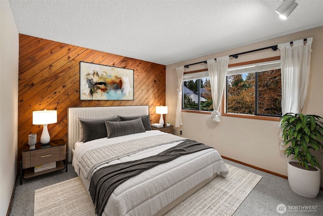 2515 87th Avenue Ct E, Edgewood, WA 98371 - carpeted bedroom featuring wooden walls and a textured ceiling