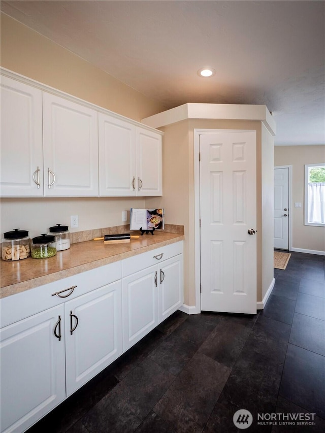 4805 Cushman Rd NE Unit 115, Olympia, WA 98506 - kitchen with white cabinetry, light countertops, recessed lighting, and dark tile patterned flooring