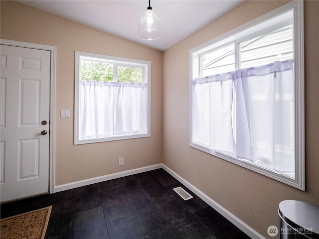 4805 Cushman Rd NE Unit 115, Olympia, WA 98506 - unfurnished dining area with baseboards and vaulted ceiling