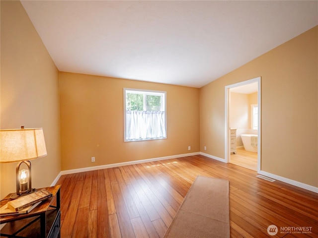 4805 Cushman Rd NE Unit 115, Olympia, WA 98506 - empty room with hardwood / wood-style flooring and baseboards