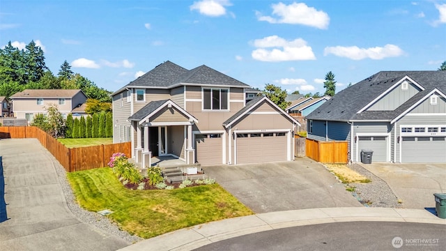 605 26th Avenue Ct, Milton, WA 98354 - traditional home featuring driveway, board and batten siding, an attached garage, a shingled roof, and a residential view