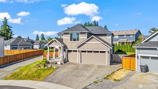 605 26th Avenue Ct, Milton, WA 98354 - view of front of house with board and batten siding, a residential view, an attached garage, driveway, and a shingled roof