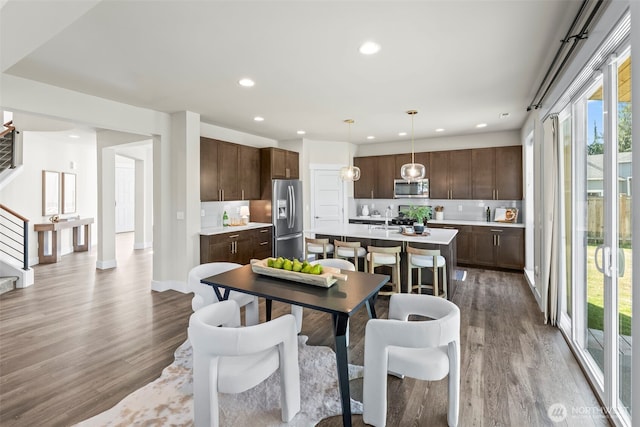 605 26th Avenue Ct, Milton, WA 98354 - dining space featuring stairway, wood finished floors, and recessed lighting