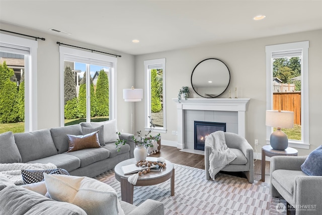 605 26th Avenue Ct, Milton, WA 98354 - living room with a fireplace, wood finished floors, healthy amount of natural light, and recessed lighting
