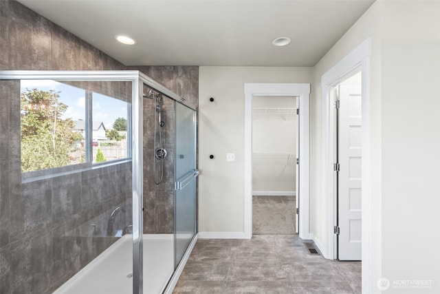 605 26th Avenue Ct, Milton, WA 98354 - bathroom with a shower stall, a spacious closet, a tub, and recessed lighting