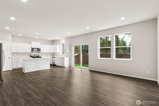 3912 23rd Ave NE Unit 38, Olympia, WA 98506 - unfurnished living room with dark wood finished floors and recessed lighting